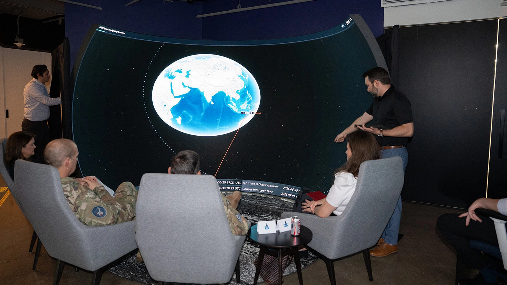 Senior leaders seated inside the NSpC dome following a live orbital scenario